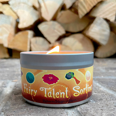 Candle in a container labeled 'Fairy Talent Sorting' with logs in the background