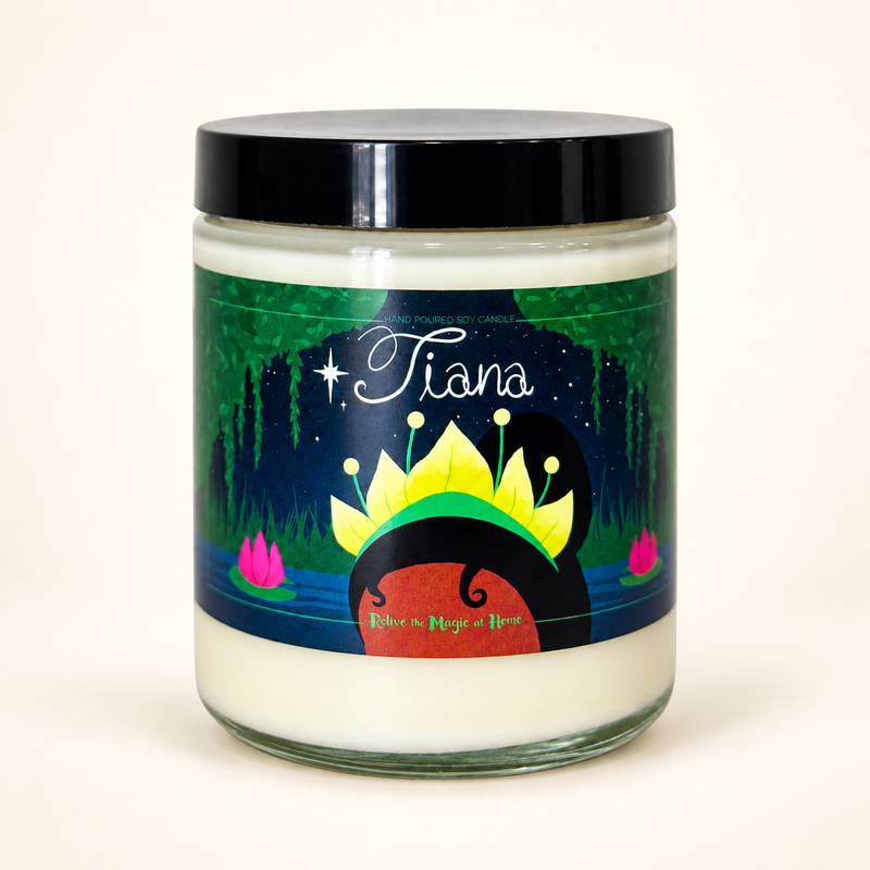 A jar candle with a black lid and a colorful label featuring the name 'Tiana' and an illustration of a crown, set against a plain light beige background.